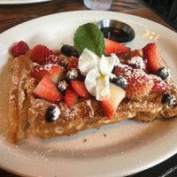 Berry waffles with vegan waffle and no whipped cream at Met Her At A Bar in Los Angeles
