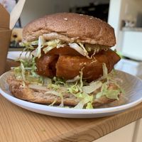 Crispy Chicken Burger w/ Orange Sauce  at Vegan Studio in Studio City