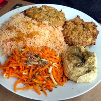 Vegetable Fritters + Rice w/tomato + Hummus + Carrot salad (vegan) at La Bonne Heure in Paris