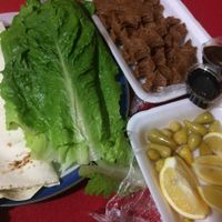 kofte (vegan meatballs from bulgur), enjoyed with lavash flatbread, pomegranate sauce, spicy pepper sauce, lemon and peppers. at CMR Cig Kofte in Kyrenia