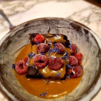 Sweet potato with cacao and peanut butter and frozen cranberries at Winners Vegan Restaurant in Athens