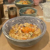 Pumpkin pasta and curry noodles (special) in the background.  at Winners Vegan Restaurant in Athens