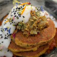 Corn pancakes with guacamole and salsa -- our favorite dish. We shared this as an appetizer at dinner. at Winners Vegan Restaurant in Athens