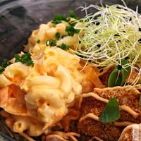 ynamite: “ Asian-marinated seitan “chicken” (not fried), baked in a coating made from whole grains and panko. Served with sushi rice, furikake, macaroni salad, miso syrup, an at Winners Vegan Restaurant in Athens