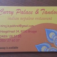 Their card with information on it at Curry Palace and Tandoor in Bruges