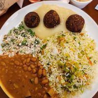 Rice, beans, peanut farofa, vegan meatballs with mashed potatoes at Pratada  in Sao Paulo