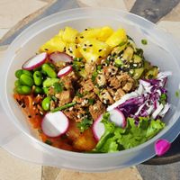 Poke bowl tofu in reusable container. at Matcha Café in Dakar