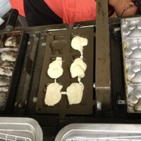 Cake batter being poured into the moulds  at Èrjiě Jīdàngāo 二姊雞蛋糕 in Tainan