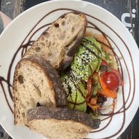 Bowl with avocado and raspberry dressing   at EM Breakfast Club in Hamburg