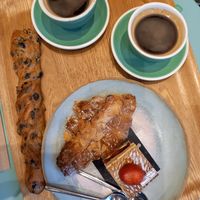 Incredible breakfast - olive bread stick, almond croissant, strawberry thing (not sure what it's called but it was amazing) at Land & Monkeys - Beaumarchais in Paris