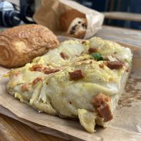 Focaccia with bacon, onion, cheese + Pain au Chocolat  at Land & Monkeys - Beaumarchais in Paris