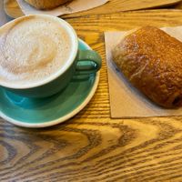 Pain au chocolate with latte  at Land & Monkeys - Beaumarchais in Paris