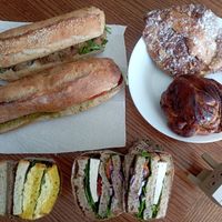 Sandwiches, croissant aux amandes and cinnamon roll at Land & Monkeys - Beaumarchais in Paris
