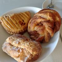 Almond pain au chocolat, cinnamon roll, chausson aux pommes at Land & Monkeys - Beaumarchais in Paris