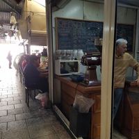 On the left is the exit/entrance to market. Friendly owner is pictured. at Chocafe in Morelia