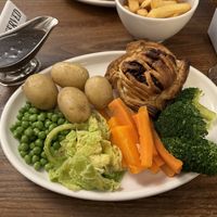 Beetroot Wellington with baby potatoes, carrots, peas, broccoli and cabbage with vegan gravy   at Goodbarns Yard in Boston