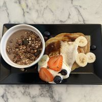Granola bowl and pancakes   at Urban Greener in Paris