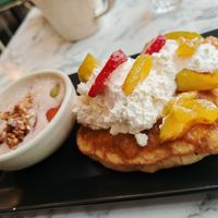 Brunch : Pancakes, apricot jam with rosemary, fresh fruit and whipped cream with banana granola. at Urban Greener in Paris