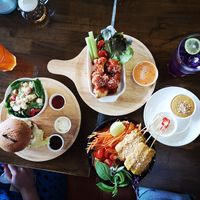 Bacon Burger with Cesar Salad, Cauliflower Wings, Date Tofu Salad, Lime Iced Tea, Butterfly Pea Iced Tea at Veganerie - Nana in Bangkok
