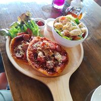 Double pizza at with Ceasar salad at Veganerie - Nana in Bangkok