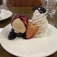 Flourless brownie with vanilla ice cream and coconut whipped cream   at Veganerie - Nana in Bangkok
