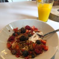 Coconut yoghurt with fruit and muesli 😊  at Blushing in Amsterdam