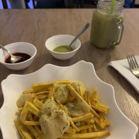 Plátanos verdes bocadillo con salsas picantes y jugo  at Verdecelli  - Coco's Cafe in Cuenca