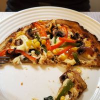 Personal sized pizza (half eaten) at Verdecelli  - Coco's Cafe in Cuenca