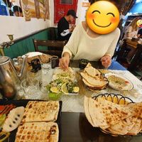 A delicious feast! 2 orders of hummus, salad, bread, and a falafel sandwhich. at Asalam Restaurant in Jeju