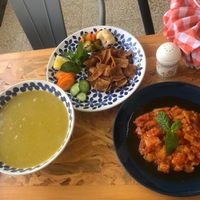 Lentil soup, tomato dish and veggies.  at Dar Ne'meh in Amman