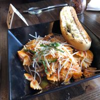 Pasta bar.. bow tie pomodoro with sweet Italian sausage, asparagus, and basil 🌿  at Tarantino's Vegan in Las Vegas