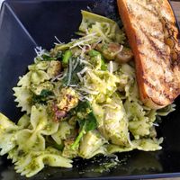 My custom build-your-own pasta bowl with bowtie noodles, pesto, veggies, and chick'n at Tarantino's Vegan in Las Vegas