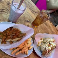 Vegan hot dog with chile con carne topping and avocado + fries and a black sesame mylkshake. Vegan hot dog with tomatoes, corn, vegan mayo.  at Bells in Tokyo