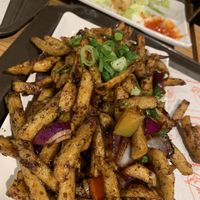 Masala chips and spring rolls (pic taken after we had started our meal, so some of the spring rolls are missing lol)  at Veggie Wok in North West London