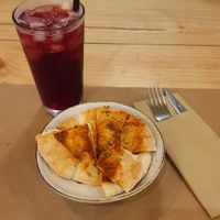 Pita with garlic & oregano, it was like a mini pizza and was only a side! at Boa Beach in Valencia