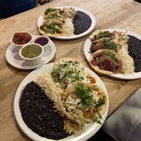 Front plate sweet potato tacos (removed creamy sauce to make vegan). Right plate Vegan Tacos. Back plate jackfruit tacos (vegetarian as shown. Remove green sauce to make vegan) at South in Leavenworth