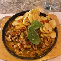 Their vegan 'pan' - nomeat chunks in curry sauce with potatoes. Great portion size and delicious.  at Qulto - Slovenska in Maribor