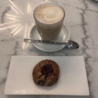 Chai latte and peanut butter and jam cookie  at The Village Coffee & Music in Utrecht