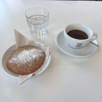 Americano and lemon chia cookie. (Location Science park).   at The Village Coffee & Music in Utrecht
