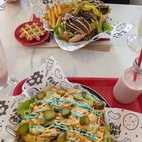 Krusty burger on fries and Ke'barb on hotdog and fries at Feed Me Fully Loaded in Nottingham