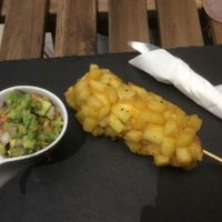 The hot dog in French fries special with a guacamole side. at Savannah Snack Bar in Belgrade