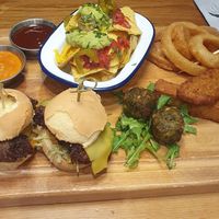 Afternoon tea: CHEESEBURGER
SLIDERS plant-based burger, vegan cheese, lettuce, Rev's Relish. Onion rings. Vegan Nachos. CRISPY FRIED CHICKEN
Plant-based chicken, with sriracha mayo at Revolution in Wilmslow