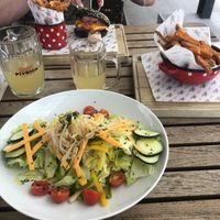 Salad with vegan cheese, sweet potato fries and burger  at Pivnica Union in Ljubljana