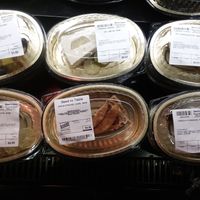 Raw vegan desserts in refrigerated case to the right of raw vegan counter/cafe (differs each day) at Seed to Table Market in Naples