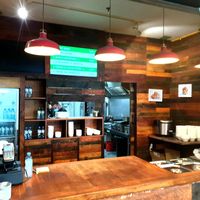 Serving counter with displayed menu.  at Vegan Om in Bratislava