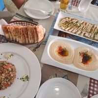 tabule salad (left) hummus and baba ghanoush covered in tahini (top) at Pita  in Merida