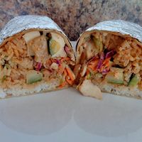 Bangkok w/ tofu. Asian cabbage, cilantro lime rice, cucumber, shredded carrots, slivered almonds, Thai-style peanut sauce, spicy cashew vinaigrette, sesame seeds  at CLE - Currito - Main Terminal in Cleveland