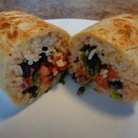 Build-You-Own Wrap. Cilantro lime rice, black beans, kale, romaine lettuce, roasted tomato salsa, pico de gallo, house vinaigrette, hot sauce, pumpkin seeds. For those who like spicy and tangy. at CLE - Currito - Main Terminal in Cleveland