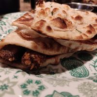 Vegan sausages naan roll at Dishoom in Manchester