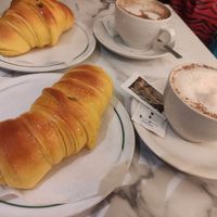 brioche croissants with capuccino at Pastelaria Tupi in Porto
